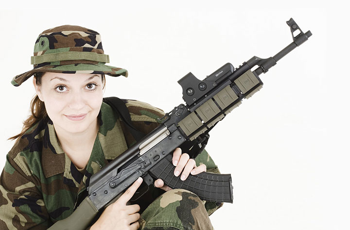 Woman posing with outfitted AK