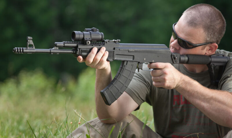 UltiMAK M1-B Optic Mount on AK held by man in shades