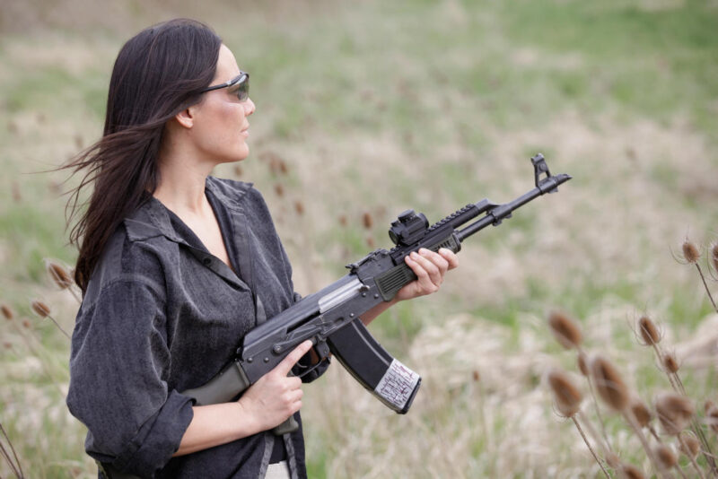 UltiMAK M2-B Optic Mount on AK-47 (held by woman)