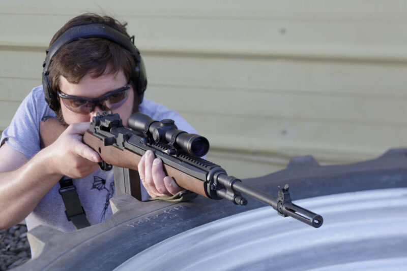 UltiMAK M8 Optic Mount on M1A, man aiming on tire